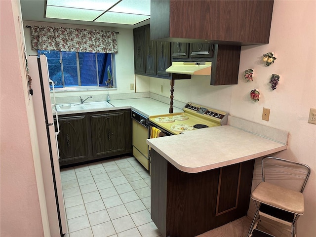 1200 37th St N Unit 403, Saint Petersburg, FL 33713 - kitchen with paneled dishwasher, range hood, a sink, a peninsula, and light countertops