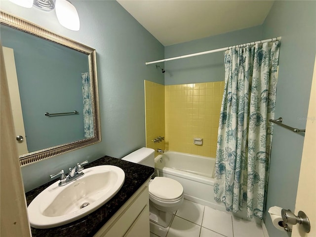 bathroom featuring shower / bath combo, tile patterned flooring, toilet, and vanity