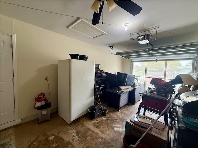 garage with a ceiling fan and a garage door opener