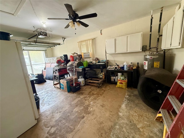 garage with electric water heater, freestanding refrigerator, a garage door opener, and ceiling fan