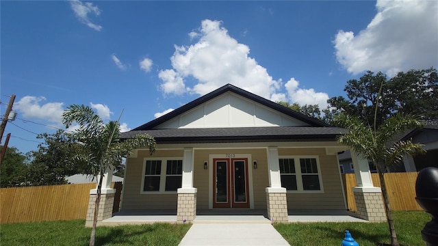 7013 N 15th St, Tampa, FL 33610 - bungalow with a porch and a shingled roof