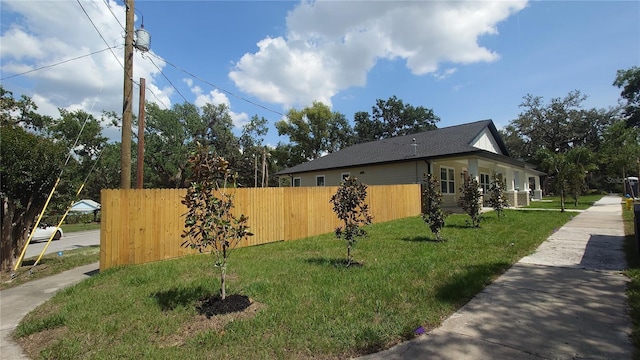 7013 N 15th St, Tampa, FL 33610 - view of side of home featuring roof with shingles