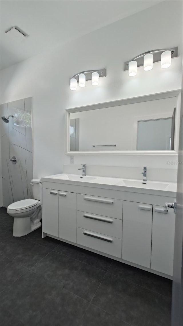 7013 N 15th St, Tampa, FL 33610 - full bathroom with double vanity, tile patterned floors, a stall shower, and toilet