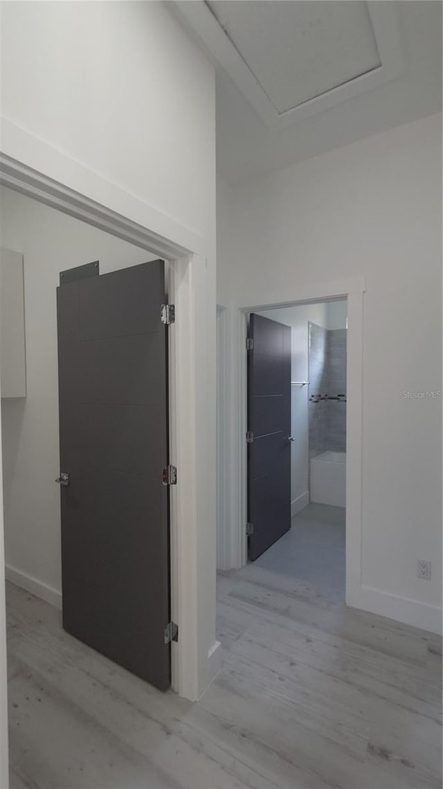 7013 N 15th St, Tampa, FL 33610 - corridor with light wood finished floors, attic access, and baseboards