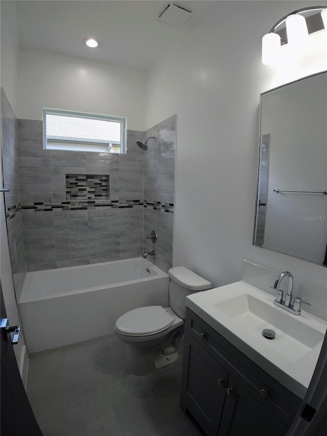 7013 N 15th St, Tampa, FL 33610 - full bath with toilet, vanity, shower / bathtub combination, and tile patterned flooring