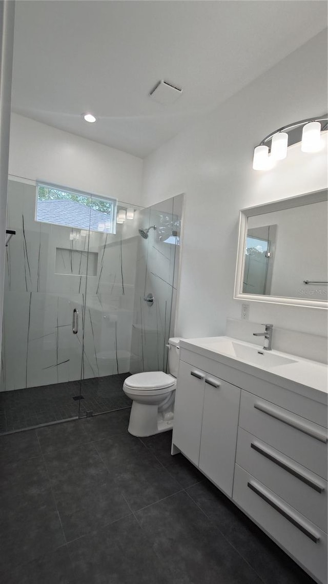 7013 N 15th St, Tampa, FL 33610 - bathroom with a marble finish shower, vanity, toilet, tile patterned floors, and recessed lighting