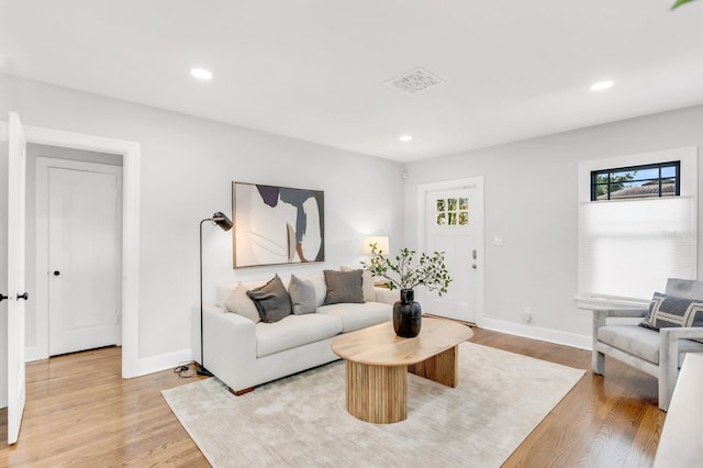 2859 Dartmouth Ave N, Saint Petersburg, FL 33713 - living area featuring baseboards, light wood finished floors, and recessed lighting