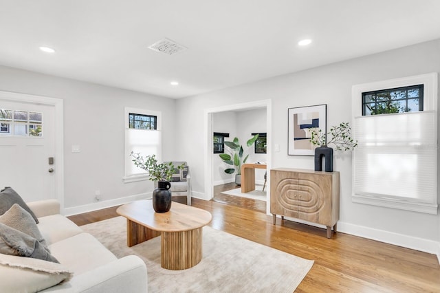 2859 Dartmouth Ave N, Saint Petersburg, FL 33713 - living area featuring plenty of natural light, light wood-type flooring, recessed lighting, and baseboards