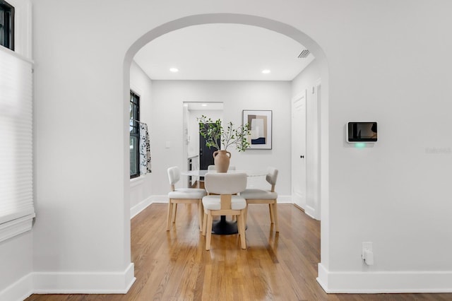 2859 Dartmouth Ave N, Saint Petersburg, FL 33713 - corridor with arched walkways, baseboards, light wood-style floors, and recessed lighting
