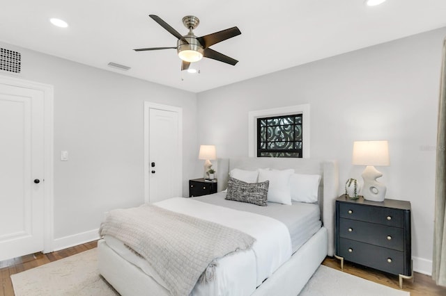 2859 Dartmouth Ave N, Saint Petersburg, FL 33713 - bedroom with wood finished floors, recessed lighting, baseboards, ceiling fan, and a closet