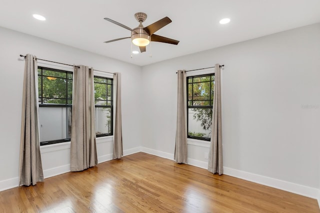 2859 Dartmouth Ave N, Saint Petersburg, FL 33713 - empty room with healthy amount of natural light, light wood-type flooring, ceiling fan, baseboards, and recessed lighting
