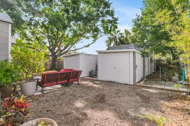 2859 Dartmouth Ave N, Saint Petersburg, FL 33713 - fenced backyard featuring a shed, an outdoor structure, and a patio area