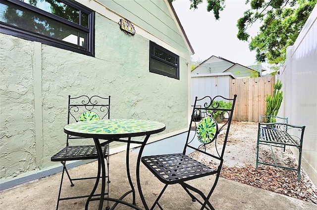 2859 Dartmouth Ave N, Saint Petersburg, FL 33713 - view of patio with fence and outdoor dining space