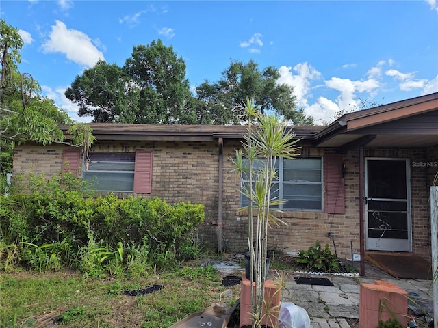 115 Marjorie Ave, Auburndale, FL 33823 - view of side of property with brick siding