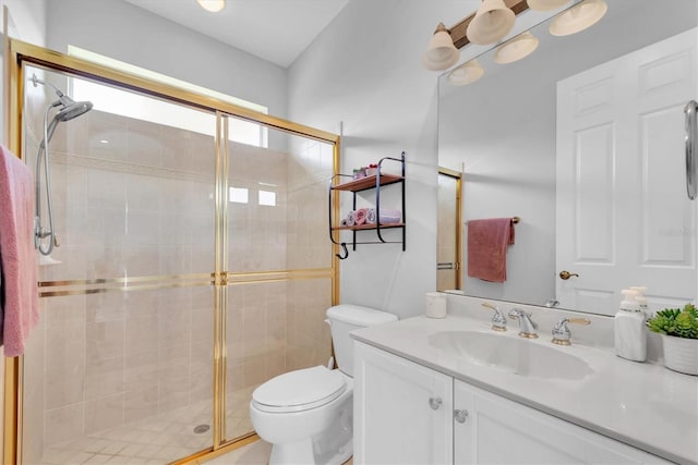 full bath featuring a shower stall, toilet, and vanity