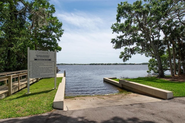 dock featuring a boat ramp and a water view