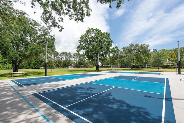 3716 Janus Way, Palm Harbor, FL 34685 - view of tennis court featuring community basketball court, view of scattered trees, and a lawn