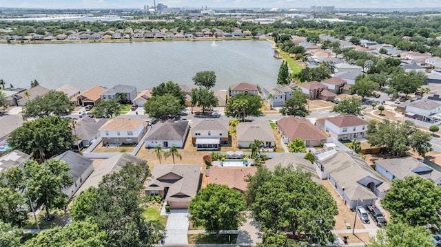 aerial perspective of suburban area with a nearby body of water