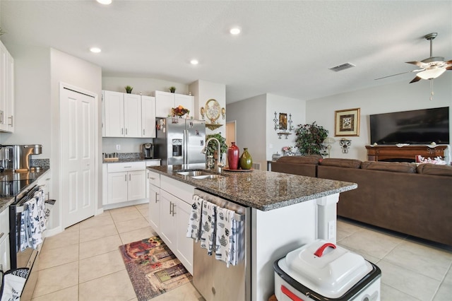 13603 Wild Ginger St, Riverview, FL 33579 - kitchen featuring stainless steel fridge, a sink, light tile patterned floors, ceiling fan, and open floor plan
