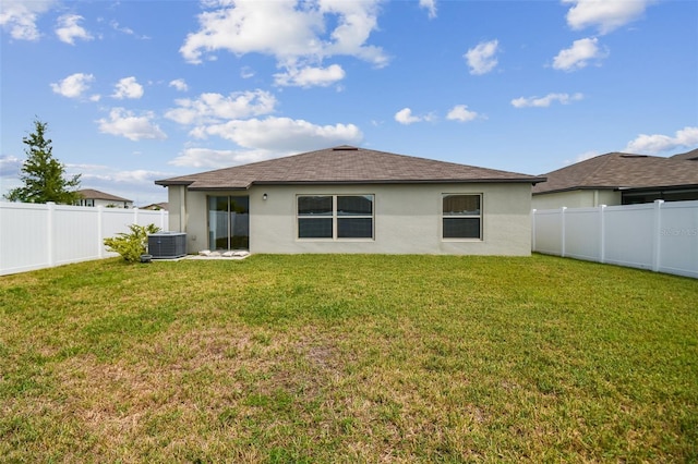 13603 Wild Ginger St, Riverview, FL 33579 - back of property with stucco siding, roof with shingles, and central air condition unit