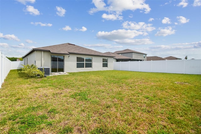 13603 Wild Ginger St, Riverview, FL 33579 - rear view of house featuring stucco siding, central AC, and roof with shingles