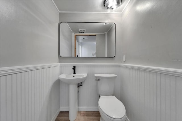 1028 Apollo Beach Blvd Unit 21, Apollo Beach, FL 33572 - half bathroom featuring wainscoting, toilet, and a sink