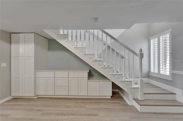 1028 Apollo Beach Blvd Unit 21, Apollo Beach, FL 33572 - stairway featuring baseboards and wood finished floors