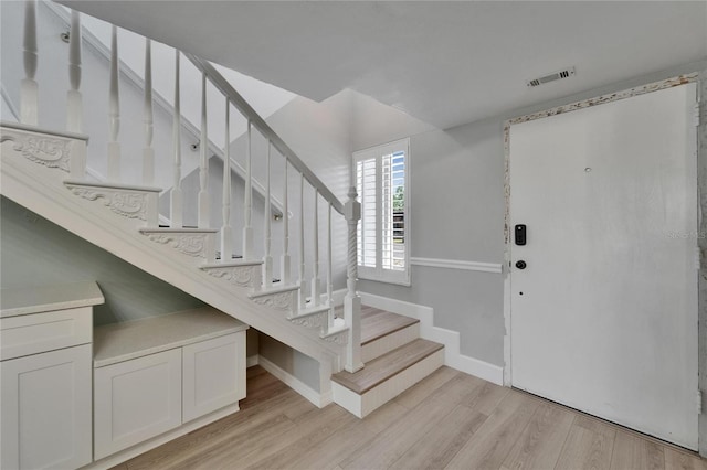 1028 Apollo Beach Blvd Unit 21, Apollo Beach, FL 33572 - foyer with stairs, light wood-style flooring, and baseboards
