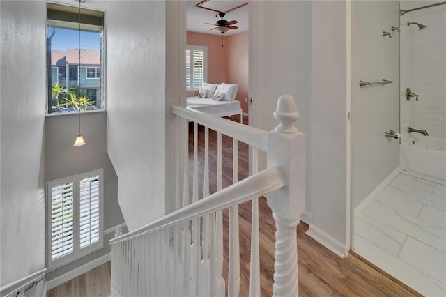 1028 Apollo Beach Blvd Unit 21, Apollo Beach, FL 33572 - stairway featuring baseboards and ceiling fan