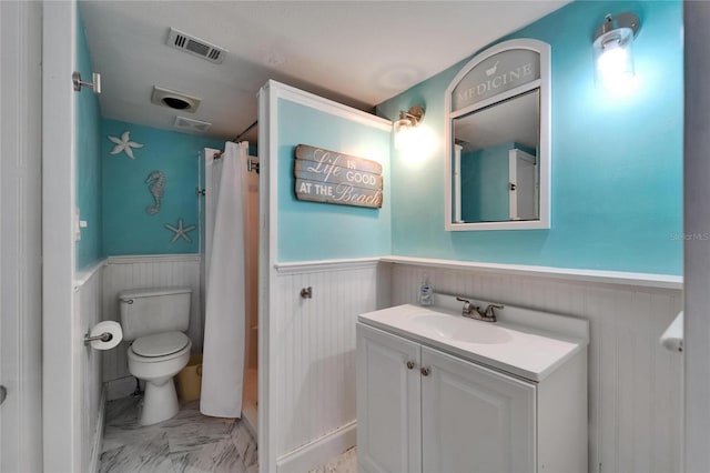 1028 Apollo Beach Blvd Unit 21, Apollo Beach, FL 33572 - full bathroom with a wainscoted wall, toilet, and vanity