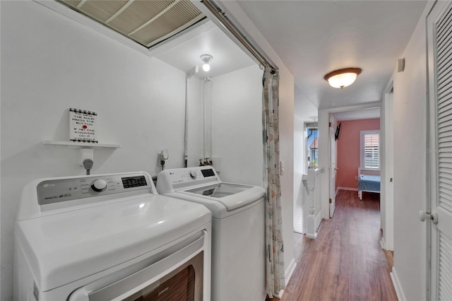 1028 Apollo Beach Blvd Unit 21, Apollo Beach, FL 33572 - washroom with separate washer and dryer, light wood-type flooring, and baseboards