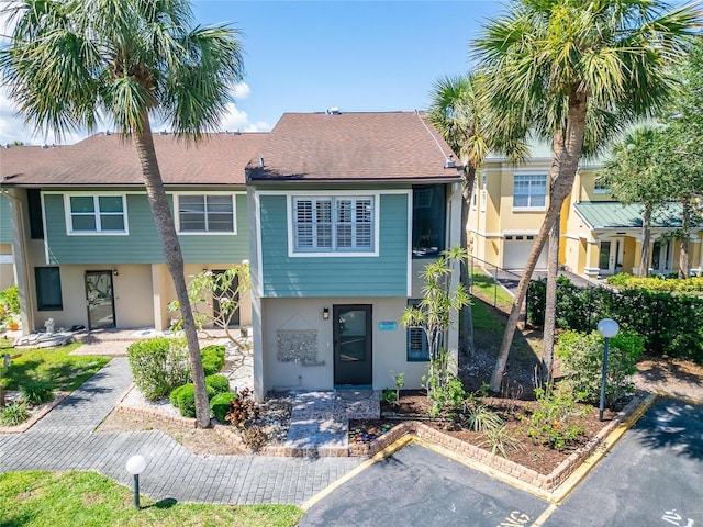 1028 Apollo Beach Blvd Unit 21, Apollo Beach, FL 33572 - view of front of property featuring stucco siding and uncovered parking