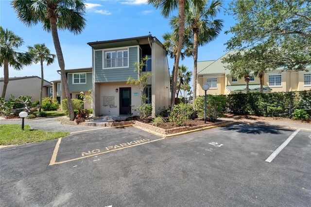 1028 Apollo Beach Blvd Unit 21, Apollo Beach, FL 33572 - view of front of home with uncovered parking and stucco siding