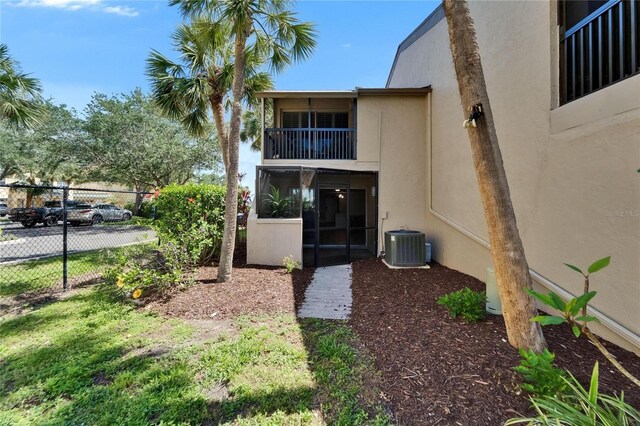 1028 Apollo Beach Blvd Unit 21, Apollo Beach, FL 33572 - back of property featuring stucco siding, fence, and central AC unit