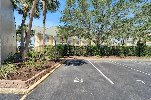 1028 Apollo Beach Blvd Unit 21, Apollo Beach, FL 33572 - uncovered parking lot with fence