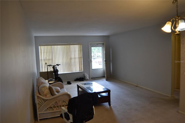 2463 Brazilia Dr Unit 43, Clearwater, FL 33763 - living area with a chandelier, carpet, and baseboards
