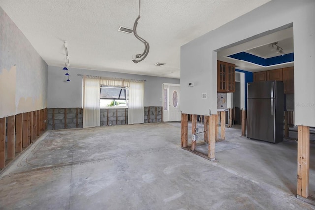 11628 Grove St, Seminole, FL 33772 - garage with freestanding refrigerator and a wainscoted wall