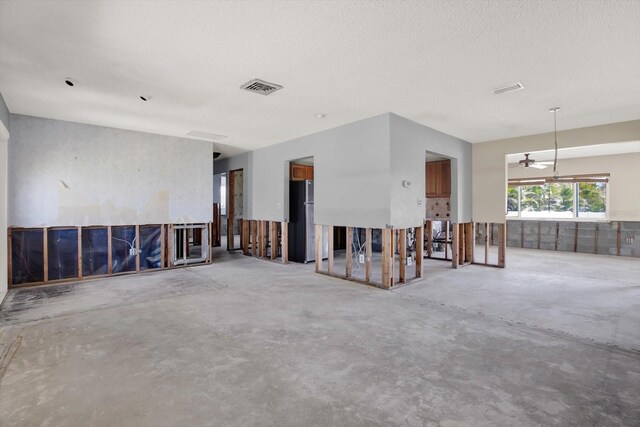 11628 Grove St, Seminole, FL 33772 - spare room with unfinished concrete flooring and a ceiling fan