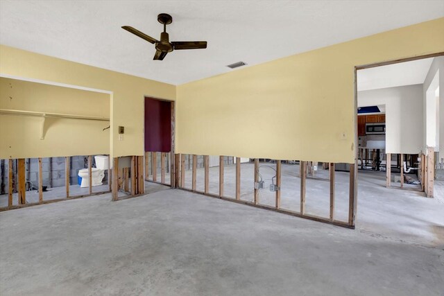 11628 Grove St, Seminole, FL 33772 - unfurnished room with ceiling fan and concrete floors