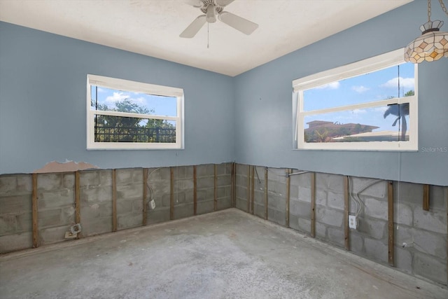 11628 Grove St, Seminole, FL 33772 - unfurnished room with ceiling fan and unfinished concrete floors