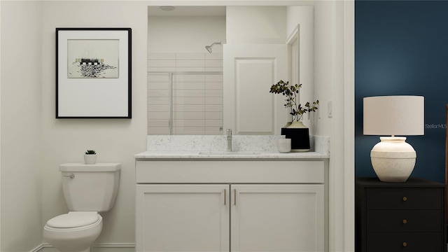 11761 E 71st Ter, Palmetto, FL 34221 - bathroom with toilet, vanity, baseboards, and a tile shower