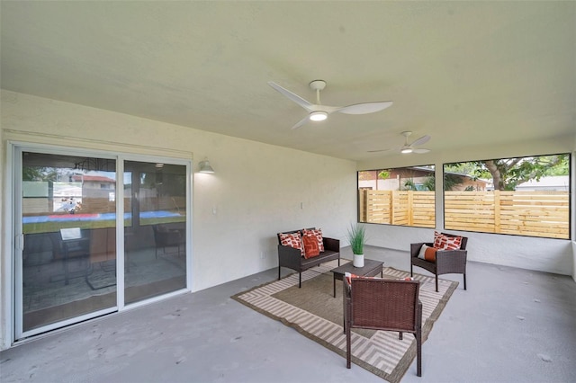 view of patio / terrace featuring a ceiling fan, fence, and outdoor lounge area