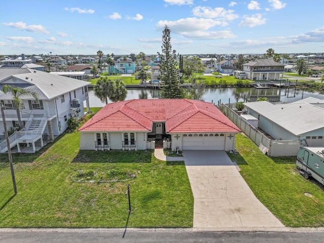 4274 Deleon Dr, Hernando Beach, FL 34607 - view of front facade with stucco siding, an attached garage, a water view, a residential view, and concrete driveway