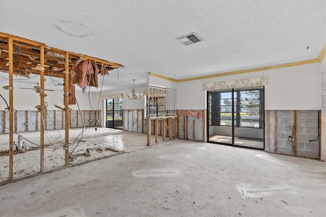 4274 Deleon Dr, Hernando Beach, FL 34607 - miscellaneous room featuring plenty of natural light, crown molding, a chandelier, and a textured ceiling