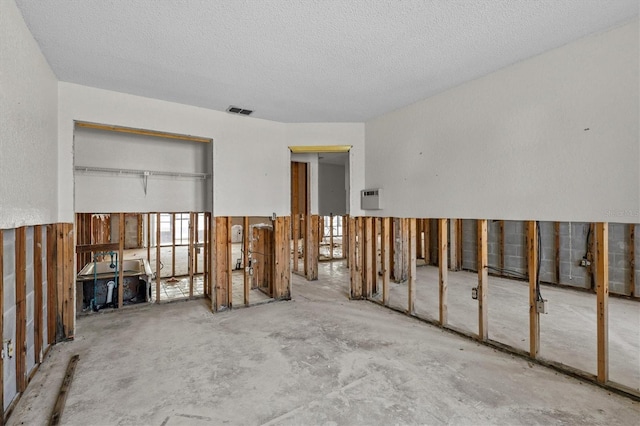 4274 Deleon Dr, Hernando Beach, FL 34607 - unfurnished living room featuring a textured ceiling