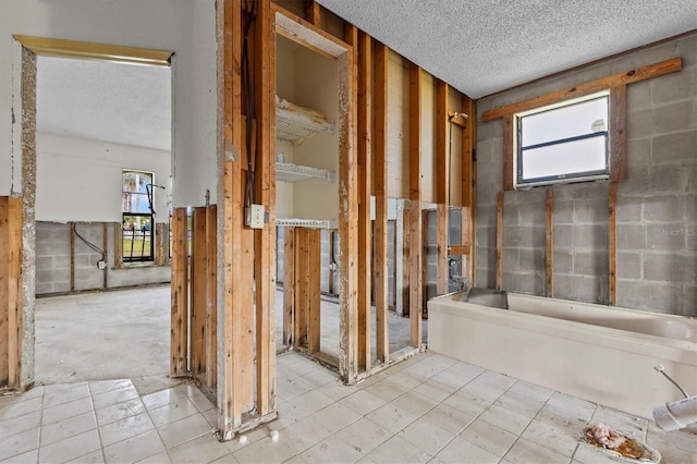 4274 Deleon Dr, Hernando Beach, FL 34607 - bathroom with a textured ceiling and plenty of natural light