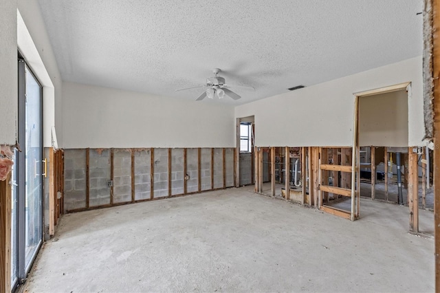 4274 Deleon Dr, Hernando Beach, FL 34607 - empty room with a textured ceiling and a ceiling fan