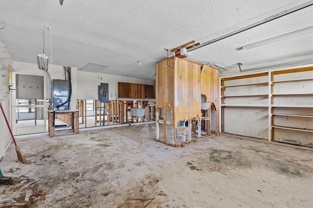 4274 Deleon Dr, Hernando Beach, FL 34607 - garage with electric panel, a garage door opener, a sink, and heating unit