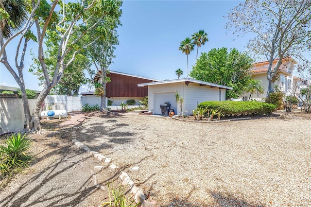 31 Dolphin Dr, Treasure Island, FL 33706 - back of house featuring an outdoor structure and a garage