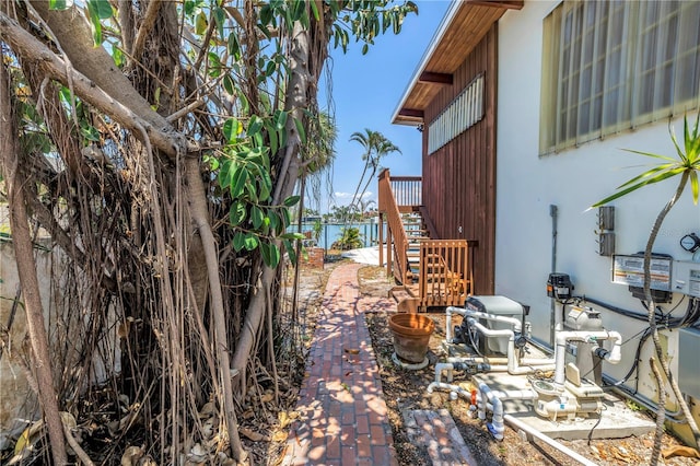 31 Dolphin Dr, Treasure Island, FL 33706 - view of property exterior featuring stairs, a patio, and fence